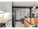 Kitchen view transitioning to the living room, highlighting the open floor plan and modern layout at 5463 Shoshone St, Denver, CO 80221