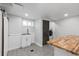 Laundry room featuring sink, cabinets, barn door, and washer and dryer at 5463 Shoshone St, Denver, CO 80221