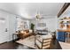 Comfortable living room featuring hardwood floors, modern furnishings, and ample natural light at 5463 Shoshone St, Denver, CO 80221