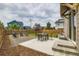Backyard featuring a patio, lawn, gravel area with seating, and wood fencing for privacy at 5975 Hanover St, Denver, CO 80238