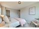 Bedroom features a neutral color scheme, carpet, and an art piece at 5975 Hanover St, Denver, CO 80238