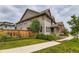 Beautifully landscaped home exterior showcasing a well-maintained lawn and tasteful plantings at 5975 Hanover St, Denver, CO 80238