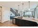 Spacious kitchen featuring an island with stainless steel appliances and seamless flow to the living area at 5975 Hanover St, Denver, CO 80238