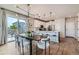 Eat-in kitchen boasting modern appliances, stylish lighting, and a seamless connection to the dining area at 5975 Hanover St, Denver, CO 80238