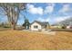 Backyard featuring a large yard, new landscaping, and stone patio at 16130 Mt Vernon Rd, Golden, CO 80401