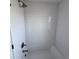 Clean white bathroom featuring tub and shower combo with subway tile surround at 16130 Mt Vernon Rd, Golden, CO 80401