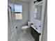 Small bathroom with new fixtures and marble floors at 16130 Mt Vernon Rd, Golden, CO 80401
