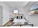 Cozy bedroom featuring natural light, wood floors, and stylish furnishings at 16130 Mt Vernon Rd, Golden, CO 80401