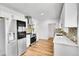 Bright modern kitchen with stainless steel appliances and stylish backsplash at 16130 Mt Vernon Rd, Golden, CO 80401
