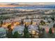 Aerial view of a home and neighborhood nestled in a suburban community with mountain views at 2988 Rockbridge Dr, Highlands Ranch, CO 80129