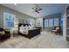 Relaxing bedroom showcasing neutral tones, plantation shutters, and comfortable seating at 2988 Rockbridge Dr, Highlands Ranch, CO 80129