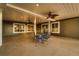 Inviting covered patio features a ceiling fan, recessed lights, and a seating area with outdoor furniture at 2988 Rockbridge Dr, Highlands Ranch, CO 80129