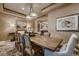 Formal dining room featuring neutral paint, a decorative light fixture, and a rustic wood table at 2988 Rockbridge Dr, Highlands Ranch, CO 80129