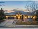 Charming single-story home boasting stone accents, gray roof, and a two-car garage at 2988 Rockbridge Dr, Highlands Ranch, CO 80129