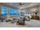 Relaxing main bedroom with a sitting area, large windows with scenic views, and ample natural light at 2988 Rockbridge Dr, Highlands Ranch, CO 80129