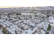 Community of townhomes in snowy landscape with mountain backdrop at 11261 W Quincy Pl, Littleton, CO 80127