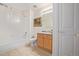 Clean bathroom with shower/tub combo and light wood vanity at 11261 W Quincy Pl, Littleton, CO 80127