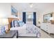 Spacious bedroom with a king-size bed and large window at 11261 W Quincy Pl, Littleton, CO 80127