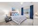 Spacious primary bedroom with a king-size bed and water view art at 11261 W Quincy Pl, Littleton, CO 80127