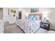 Main bedroom with a king-size bed and walk-in closet at 11261 W Quincy Pl, Littleton, CO 80127