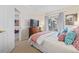 Bedroom with a queen-size bed and access to another room at 11261 W Quincy Pl, Littleton, CO 80127