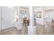 Formal dining area with hardwood floors and view into kitchen at 11261 W Quincy Pl, Littleton, CO 80127