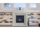 Elegant fireplace with built-in shelving and decorative accents at 11261 W Quincy Pl, Littleton, CO 80127