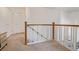 Upstairs hallway with staircase and carpet flooring at 11261 W Quincy Pl, Littleton, CO 80127