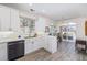Bright kitchen with an eat-in area and access to a patio at 11261 W Quincy Pl, Littleton, CO 80127