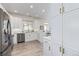 Open concept kitchen with ample storage and stainless steel appliances at 11261 W Quincy Pl, Littleton, CO 80127