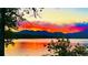 Scenic lake view with fiery sunset reflection at 11261 W Quincy Pl, Littleton, CO 80127