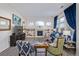 Comfortable living room with fireplace and blue sofa at 11261 W Quincy Pl, Littleton, CO 80127
