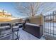 Patio with seating and a built-in grill, covered in snow at 11261 W Quincy Pl, Littleton, CO 80127