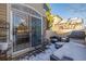 Small patio with seating and a view into the home at 11261 W Quincy Pl, Littleton, CO 80127