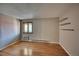 Bedroom with wood floors, window, and air conditioner at 14780 E Kentucky Dr # 432, Aurora, CO 80012