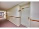 Hallway leading to unit with door, and decor at 14780 E Kentucky Dr # 432, Aurora, CO 80012