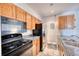 Well-lit kitchen with stainless steel appliances, granite countertops, and ample cabinetry for storage at 14780 E Kentucky Dr # 432, Aurora, CO 80012