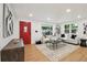 Inviting living room showcasing a red front door, sleek furniture, and natural light at 5515 Dudley Ct, Arvada, CO 80002
