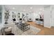 Bright living room featuring modern decor, an open layout, and hardwood floors at 5515 Dudley Ct, Arvada, CO 80002