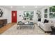 Spacious living room featuring a red door, neutral tones, and elegant furnishings at 5515 Dudley Ct, Arvada, CO 80002