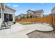 A lovely backyard, partially snow-covered, with patio furniture, a concrete patio, and wood fence at 3980 Trail Stone Cir, Castle Rock, CO 80108