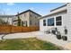 Backyard features a well-maintained lawn, patio, grill, and exterior of the house, perfect for outdoor living at 3980 Trail Stone Cir, Castle Rock, CO 80108