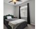 This bedroom features great natural light, a ceiling fan, and a neutral color palette at 3980 Trail Stone Cir, Castle Rock, CO 80108