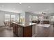 Modern kitchen features granite countertops, stainless steel appliances, and seamless flow to the dining and living spaces at 3980 Trail Stone Cir, Castle Rock, CO 80108