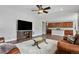 Inviting living room with hardwood floors, open layout, seamlessly connects to the kitchen and dining area at 3980 Trail Stone Cir, Castle Rock, CO 80108