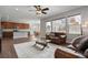 Open-concept living room, hardwood floors, with comfortable seating, and seamless access to the kitchen and dining area at 3980 Trail Stone Cir, Castle Rock, CO 80108