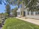 This well-maintained backyard features a lush lawn, mature trees, and a patio area for outdoor enjoyment at 10904 Eagle Run Dr, Parker, CO 80138