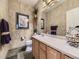 Stylish bathroom with a wide vanity, decorative mirror, and elegant fixtures complementing the neutral decor at 10904 Eagle Run Dr, Parker, CO 80138
