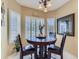 Cozy dining nook featuring an elegant chandelier and large windows with shutter-style shades at 10904 Eagle Run Dr, Parker, CO 80138