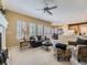 Spacious living area with plantation shutters, fireplace, and seamless flow into the kitchen and dining nook at 10904 Eagle Run Dr, Parker, CO 80138